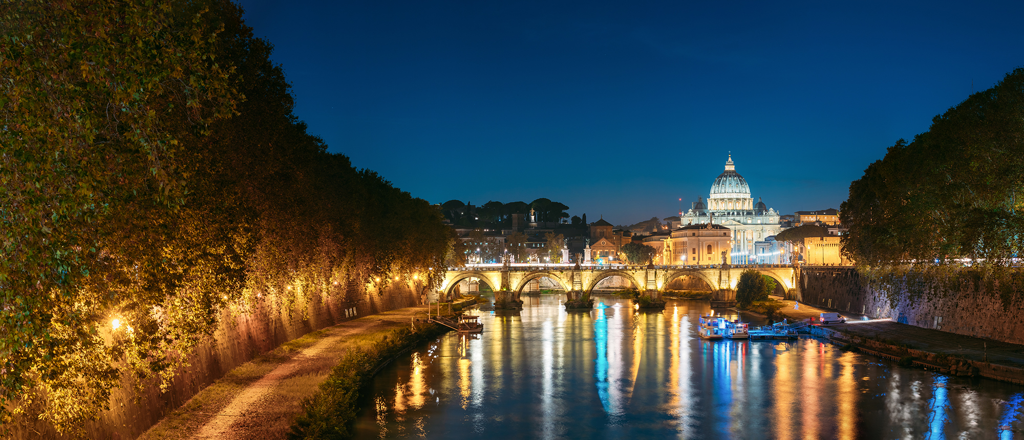 Rome, Italy. Papal Basilica Of St. Peter In The Vatican And Aelian Bridge In Evening Night Illuminations. Panoramic View